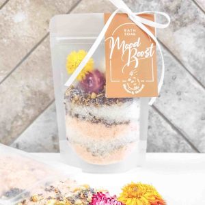 A bath soak pack featuring Himalayan pink salt, Dead Sea salt, pink Australian clay, and flowers.